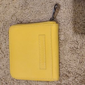 Yellow BCBG zip around wallet